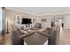Expansive living room showcasing an entertainment center, three sofas, and a modern design aesthetic at 1129 Prescott Circle, Myrtle Beach, SC 29577