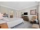 Bright main bedroom featuring an ensuite bathroom, walk-in closet, and a cozy sitting area at 1129 Prescott Circle, Myrtle Beach, SC 29577