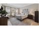 Comfortable main bedroom with a metal bed frame and lots of natural light from the windows at 1129 Prescott Circle, Myrtle Beach, SC 29577