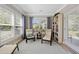 Inviting sitting area with bright windows, comfortable chairs, and a stylish bookcase at 1129 Prescott Circle, Myrtle Beach, SC 29577