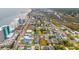 Scenic aerial view showcasing a coastal neighborhood with colorful homes and access to the beach at 113 B Vista Dr., Murrells Inlet, SC 29576