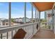 Enclosed balcony offering neighborhood views on sunny day with blue skies at 113 B Vista Dr., Murrells Inlet, SC 29576