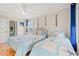 Bright bedroom with hardwood floors, ceiling fan, two beds and nautical decor at 113 B Vista Dr., Murrells Inlet, SC 29576