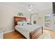 Serene bedroom highlighting a queen bed, hardwood floors, and outdoor access at 113 B Vista Dr., Murrells Inlet, SC 29576