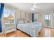 Bright bedroom with hardwood floors, ceiling fan, two beds and nautical decor at 113 B Vista Dr., Murrells Inlet, SC 29576