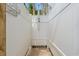Enclosed outdoor shower area featuring white privacy fencing and a convenient shower head at 113 B Vista Dr., Murrells Inlet, SC 29576