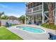 Charming backyard pool area with Adirondack chairs on a sunny day, providing a relaxing outdoor space at 113 B Vista Dr., Murrells Inlet, SC 29576