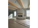 Unfinished living room features natural wood beams and an unfinished fireplace with custom cabinets at 1348 Rue De Jean Ave., Myrtle Beach, SC 29579