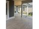 Covered patio with light gray tiling and decorative ceiling is ready for relaxing and entertaining at 1348 Rue De Jean Ave., Myrtle Beach, SC 29579