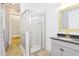 Well-lit bathroom features a glass shower, marble tile, and modern vanity at 1359 Peterson St., Myrtle Beach, SC 29577