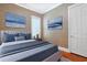 Styled bedroom with wallpapered walls, hardwood floors, and a window at 1359 Peterson St., Myrtle Beach, SC 29577