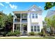 Charming two-story home featuring a welcoming porch and manicured landscaping at 1359 Peterson St., Myrtle Beach, SC 29577