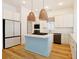 Modern kitchen with stainless appliances, island and wood floors at 1359 Peterson St., Myrtle Beach, SC 29577