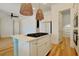 Modern kitchen with stainless appliances, island and wood floors at 1359 Peterson St., Myrtle Beach, SC 29577