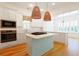 Modern kitchen with stainless appliances, island and wood floors at 1359 Peterson St., Myrtle Beach, SC 29577
