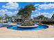 Lazy river pool area featuring lush landscaping, lounge seating, and tranquil blue water under sunny skies at 1359 Peterson St., Myrtle Beach, SC 29577