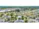 Aerial view showcasing the neighborhood, pond, proximity to shops and lush green surroundings at 1361 Turkey Ridge Rd. # C, Surfside Beach, SC 29575