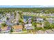 Aerial view of a residential neighborhood with a pond, mature trees, and well-maintained homes at 1361 Turkey Ridge Rd. # C, Surfside Beach, SC 29575