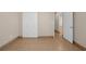 Bedroom featuring tile flooring, fresh paint, an closet and a doorway leading to a hallway at 1361 Turkey Ridge Rd. # C, Surfside Beach, SC 29575