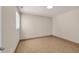 Empty bedroom with tile flooring, a window, fresh neutral-colored paint, and electrical outlets at 1361 Turkey Ridge Rd. # C, Surfside Beach, SC 29575