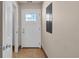 The tiled foyer offers a view of the front door, a doorway, and an electrical panel at 1361 Turkey Ridge Rd. # C, Surfside Beach, SC 29575