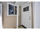 The front door is next to a window and has white trim and a dark-colored door knob at 1361 Turkey Ridge Rd. # C, Surfside Beach, SC 29575