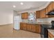 Traditional kitchen featuring wood cabinets, neutral countertop, and tile floors at 1361 Turkey Ridge Rd. # C, Surfside Beach, SC 29575