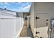 This property has a side yard with a white fence, landscaping rocks, and access to utilities at 1361 Turkey Ridge Rd. # C, Surfside Beach, SC 29575