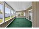 Bright sun room with large windows offering plenty of natural light and views of the outdoors at 1361 Turkey Ridge Rd. # C, Surfside Beach, SC 29575