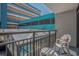 Balcony featuring metal railings and seating, overlooking the pool and neighboring buildings at 1501 S Ocean Blvd. # 320, Myrtle Beach, SC 29577