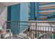 Outdoor balcony with metal railings and seating; offers views of neighboring buildings at 1501 S Ocean Blvd. # 320, Myrtle Beach, SC 29577