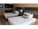 Cozy bedroom featuring two comfortable beds and a kitchenette at 1501 S Ocean Blvd. # 320, Myrtle Beach, SC 29577