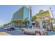Exterior view of a building featuring parking spaces and lush landscaping for a welcoming atmosphere at 1501 S Ocean Blvd. # 320, Myrtle Beach, SC 29577