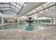 Indoor pool with fountain feature under a glass ceiling with lounge chairs and seating at 1501 S Ocean Blvd. # 320, Myrtle Beach, SC 29577