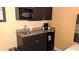 Efficient kitchenette with microwave, sink, and mini-refrigerator at 1501 S Ocean Blvd. # 320, Myrtle Beach, SC 29577