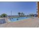 Outdoor pool surrounded by lounge chairs, palm trees, and beachfront views at 1501 S Ocean Blvd. # 320, Myrtle Beach, SC 29577