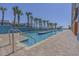 Resort-style swimming pool with palm trees and easy access via stairs at 1501 S Ocean Blvd. # 320, Myrtle Beach, SC 29577