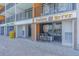 Restaurant exterior with outdoor seating and colorful signage, 