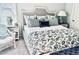 Elegant bedroom with stylish bedding, comfortable seating, and ample natural light at 1608 Harbor Dr., North Myrtle Beach, SC 29582