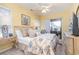 Inviting bedroom featuring bright yellow walls, a plush bed, and balcony access at 1608 Harbor Dr., North Myrtle Beach, SC 29582