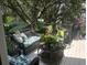 Inviting deck space with wicker furniture and lush potted plants, creating a serene outdoor living area at 1608 Harbor Dr., North Myrtle Beach, SC 29582