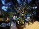 Charming deck with cozy wicker seating, soft cushions, and ambient lighting for relaxed evenings at 1608 Harbor Dr., North Myrtle Beach, SC 29582