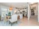 Bright dining area with modern chandelier, adjacent to the kitchen with stainless steel appliances at 1608 Harbor Dr., North Myrtle Beach, SC 29582