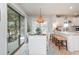 Dining area adjacent to the kitchen, featuring modern lighting and a sliding door to outdoor balcony at 1608 Harbor Dr., North Myrtle Beach, SC 29582