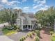 Beautiful coastal home featuring elevated construction, a tower, roof deck, and meticulously landscaped grounds at 1608 Harbor Dr., North Myrtle Beach, SC 29582
