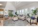 Light-filled living room featuring vaulted ceilings, plantation shutters, and balcony access at 1608 Harbor Dr., North Myrtle Beach, SC 29582