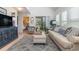 Inviting living room featuring vaulted ceilings, plantation shutters, and access to an outdoor balcony at 1608 Harbor Dr., North Myrtle Beach, SC 29582