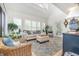 Bright and airy living room with high ceilings, plantation shutters, and stylish furnishings at 1608 Harbor Dr., North Myrtle Beach, SC 29582