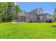 Beautiful backyard with a screened-in porch and outdoor grill area at 209 Bouquets Green Way, Myrtle Beach, SC 29579