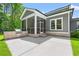 Backyard patio features a grill and a screened-in porch at 209 Bouquets Green Way, Myrtle Beach, SC 29579